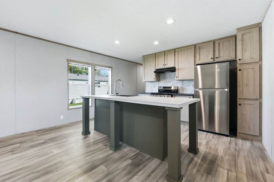 Open kitchen with island and stainless appliances, Fort Wayne
